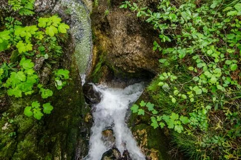 Small waterfall with rocks while hiking Stock Photos