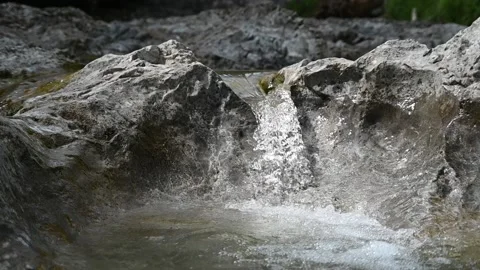A small waterfall from a rocky mountain river in summer (slow motion) Stock-Footage 212739857