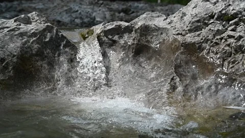 A small waterfall from a rocky mountain river in summer (slow motion) Stock-Footage 212739921