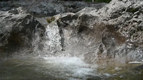 A small waterfall from a rocky mountain river in summer Video stock 212741195