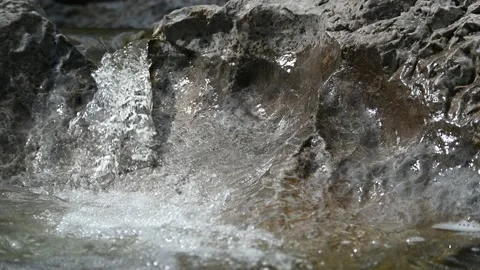 A small waterfall from a rocky mountain river in summer (slow motion) Stock-Footage 212741235