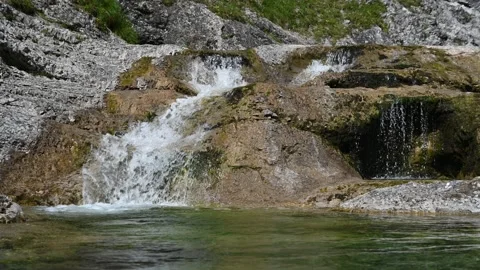 A small waterfall of a rocky mountain stream in Bavaria Stock Footage 219634712