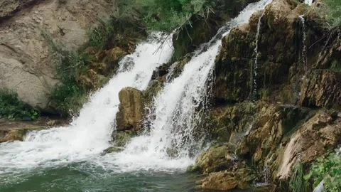A small waterfall in the Siberian forest. Slow motion. Video stock 134173753