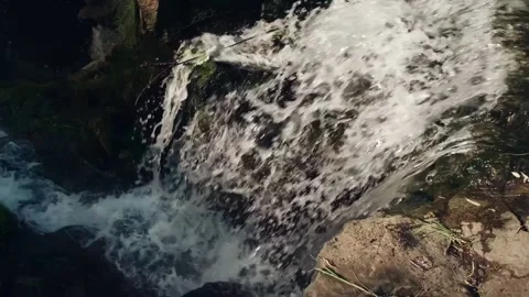 A small waterfall in the Siberian forest. Slow motion. Video stock 134174062