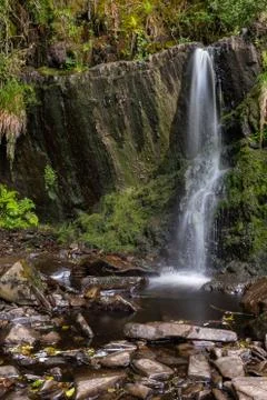 Small waterfall spout at the Cascades loop walk in a small Irish village of L Stock Photos