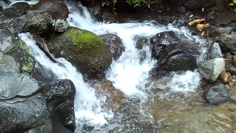 Small waterfall stream and river stream on small river at mountain Video stock 124728726