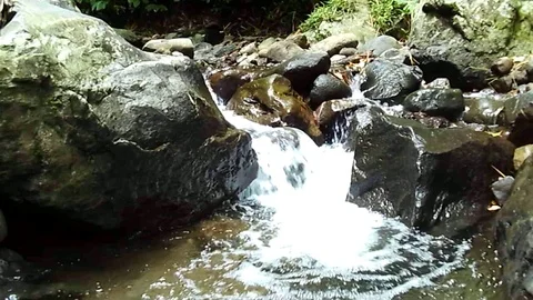 Small waterfall stream on montel river part of montel waterfall on java Stock Footage 125125609