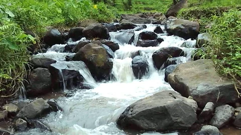 Small waterfall stream on the river mountain on java island Stock Footage 126087606