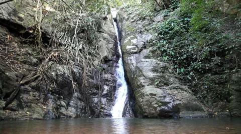 Small waterfall is stream through rock in forest at north Thailand Stock Footage 44787587