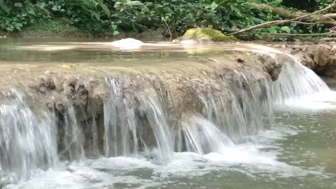 Small waterfall in summer. Small mountain river flowing in forest. Video stock 114059249