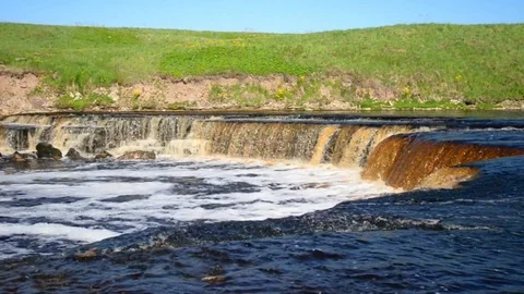 Small waterfall at sunny day. Stock Footage 76429246