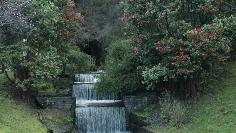 Small waterfall surrounded by a natural environment in Cudillero, Asturias. Stock Footage 305039875
