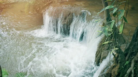 Small waterfall at Thi Lo Su, Prominent cascades in forested mountains Stock Footage 221457797