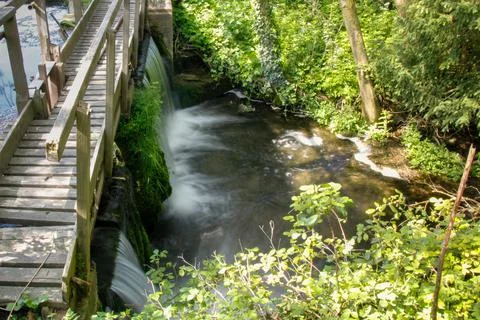 Small waterfall under bridge Foto stock