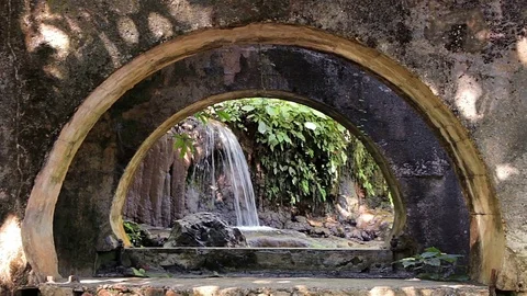 Small waterfall viewed through an old building. San Luis Potosi, Mexico. Stock Footage 70820153