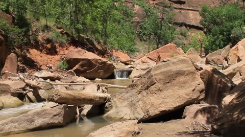 Small waterfall from Virgin River flows through the Zion Canyon Stock Footage 40715270
