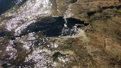 Small waterfall, water is flowing in a tiny rock pool, clear water, ecosystem Video stock 164801791