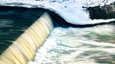 Small waterfall with water motion. Stock Photos