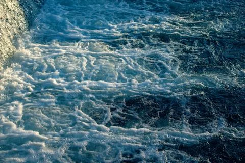 Small waterfall with water motion. Stock Photos