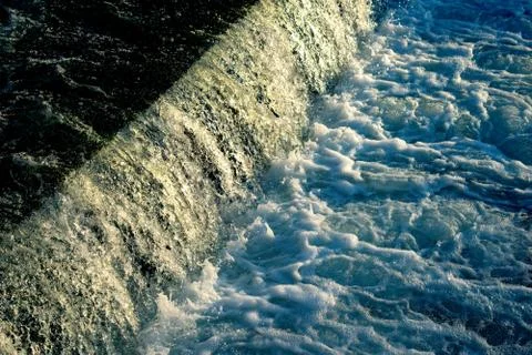 Small waterfall with water motion. Stock Photos
