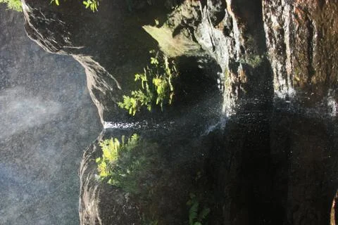 Small waterfall with zenith light Foto stock