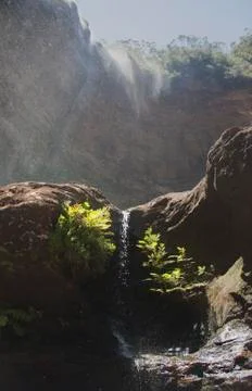Small waterfall with zenith light Stock Photos