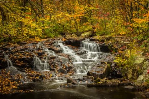 Small waterfalls in the fall 2 Stock Photos