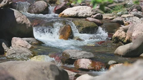 Small waterfalls in a rocky mountain river stream Stock Footage 329021532