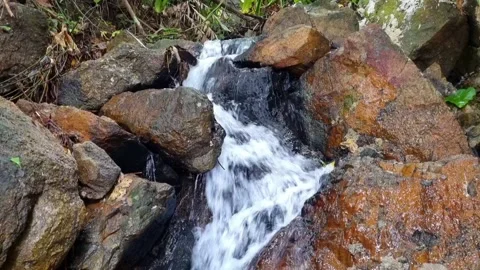 Small waterfalls running over rocks 스톡 동영상 222772537