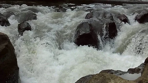 Small waterfalls stream on the big river Stock Footage 125465255