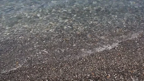 A small wave on the beach. Video stock 85217399