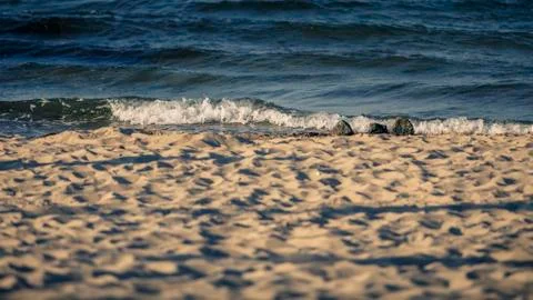 Small wave on the beach Stock Photos