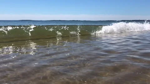 Small wave brakes on beach Stock Footage 288041394