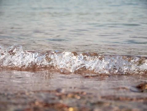 Small Wave Breaking on Sandy Shore Stock Photos