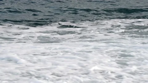 Small wave breaks on the shore Stock Footage 143455073
