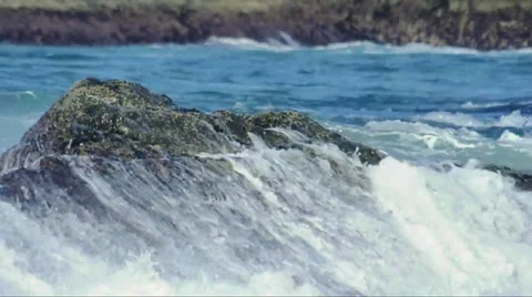 Small wave crash on rocks Stock Footage 24846009