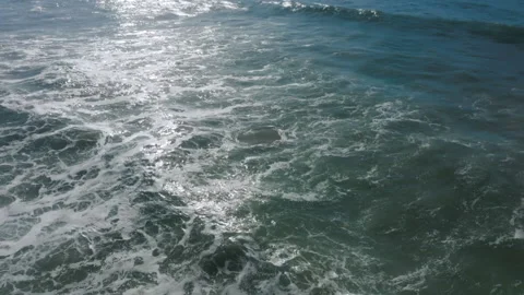 Small wave rolling from above. Top aerial view on blue turquoise ocean Stock Footage 130696517