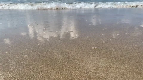 Small wave, Soft waves on sand beach for opening video, text space. Stock Footage 243098439
