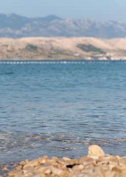 Small wave splashes over pebble Stock-Fotos