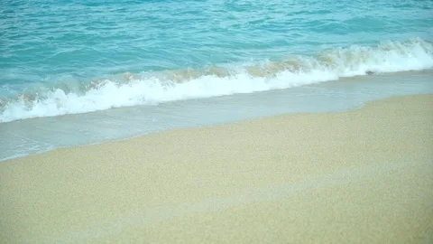 Small wave white sand beach, Ocean Wave On Sandy Beach Stock Footage 128413526