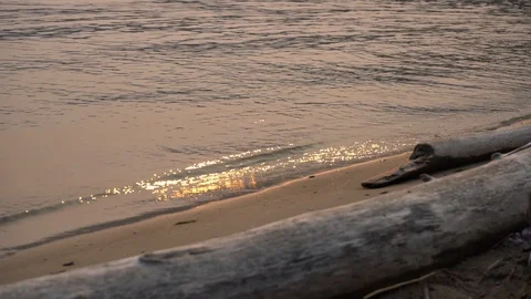 Small waves along the coastal line with reflections from the sun Video stock 112952116