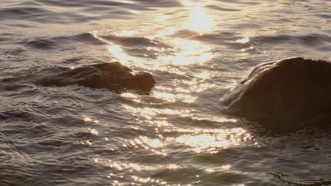 Small Waves And Rocks At Sunset Stock Footage 87396757