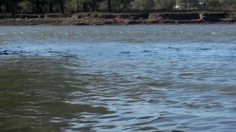 Small waves that are produced by the flow of water to the mouth of the Stock Footage 71049239