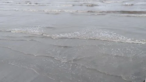 Small waves of the beach in the afternoon from above Stock Footage 272583625