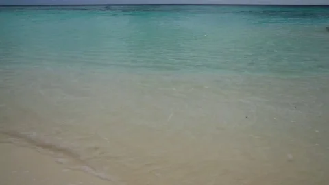 Small waves on the beach on an island Stock Footage 82497970