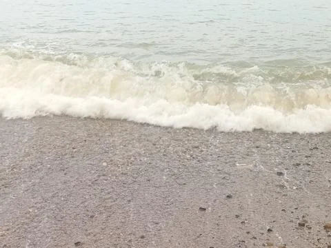 Small waves on the beach Stock Photos