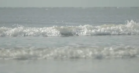 Small waves at a beach in slow motion detail Stock Footage 76676998