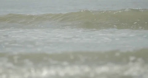 Small waves at a beach in slow motion detail Stock Footage 76677004