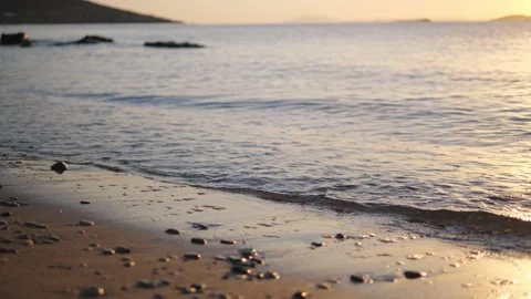 Small waves on the beach at sunrise Video stock 220501497