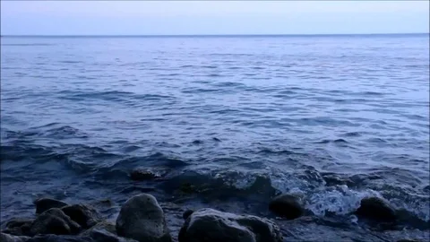 Small waves beating against the rocks, accelerated Stock Footage 77862866